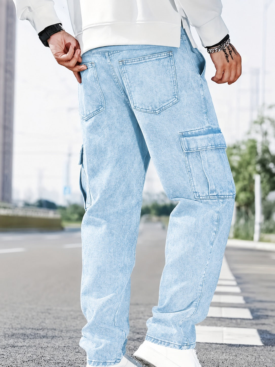 Light blue relaxed-fit cargo jeans for men with stylish utility pockets and washed denim fabric.