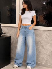Women’s light blue high-rise super baggy jeans with a relaxed wide-leg fit for casual streetwear fashion.