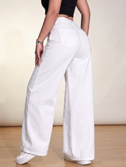 Close-up of high-waisted waistband and front button on women's white jeans